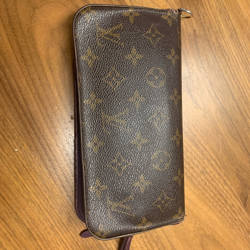 Louis Vuitton authentic wallet.  Beautified purple color inside.holds a lot